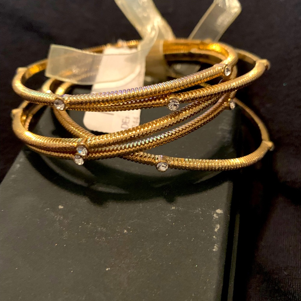 Gold bangles with diamond accents